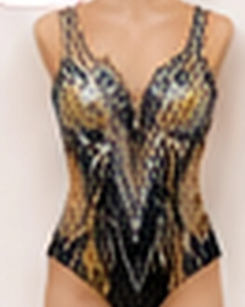 Diseño de maillot negro y dorado Rítmica Center